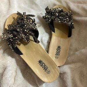 Fun, black and gold beach slip on